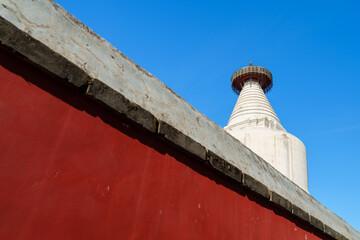 White Pagoda and Red Wall of a Temple in Beijing