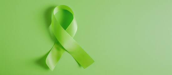 Flatlay lime green cancer ribbon blank background lymphoma, non-hodgkin lyme disease duchenne muscular duchenne muscular dystrophy mitochondrial support awareness fundraising survivor copy space