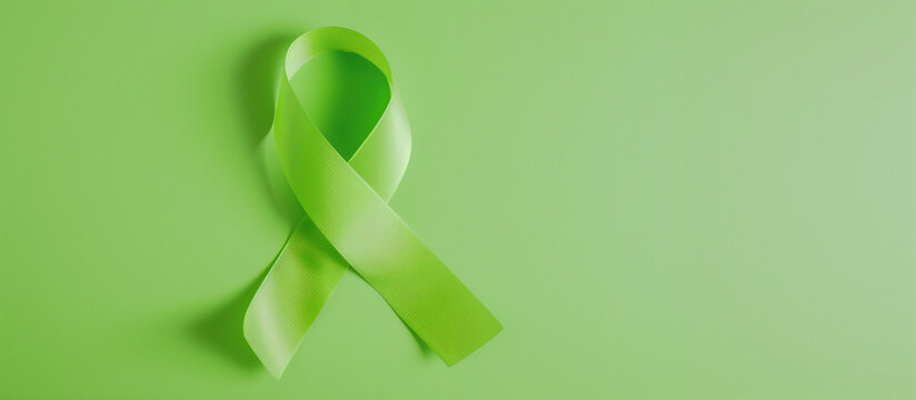 Flatlay lime green cancer ribbon blank background lymphoma, non-hodgkin lyme disease duchenne muscular duchenne muscular dystrophy mitochondrial support awareness fundraising survivor copy space