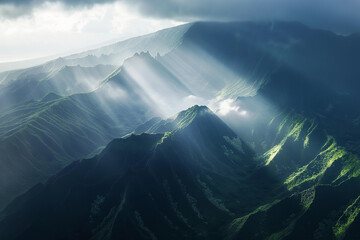Dramatic Sunrays Over Misty Mountain Peaks