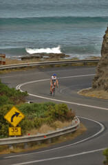 Cyclist  travels the scenic Great Ocean Road in south Western Victoria