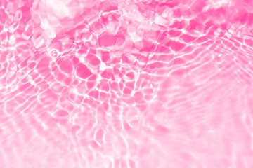 Pink water bubbles on the surface ripples. Defocus blurred transparent pink colored clear calm...