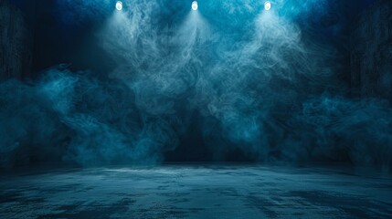 Blue spotlights illuminate the empty stage with smoke.