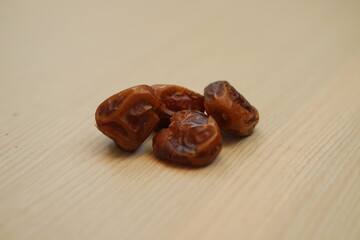 Dates fruit on wooden background. Healthy eating and dieting concept.