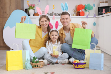 Happy family with shopping bags sitting in kitchen. Easter Sale