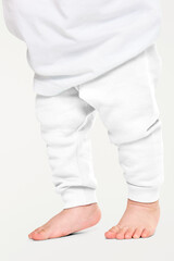 Child in png sweat pants mockup with barefoot