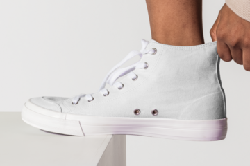 Png white canvas sneakers mockup for streetwear apparel shoot