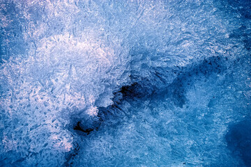 Needle snowflakes close-up. Sharp snow. Snow texture.