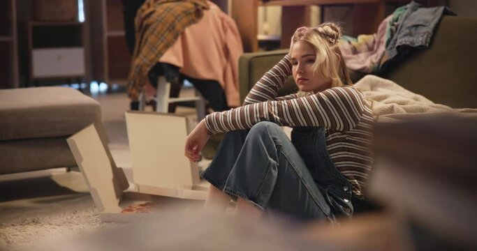 Woman, sad and frustrated in living room with depression for unemployment, failure and lonely on the floor. Person, stress and bored in home with mental health, anxiety and worry with disappointment