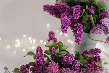 A beautiful composition of lilac bouquets on a light background, creating a soft and elegant atmosphere