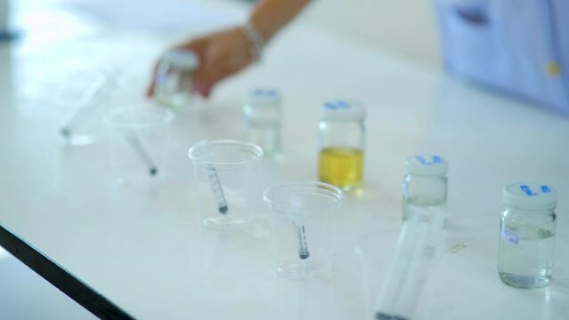 Experimenting with chemicals in the lab.