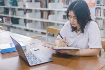 girl student study online with teacher, happy young woman with internet learning in library, distance education