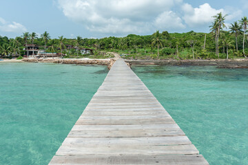 Wooden bridge on sea for entry to the beautiful island. - 789832643