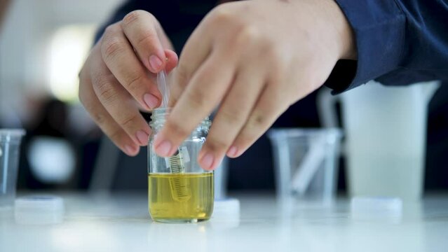 Experimenting with chemicals in the lab.