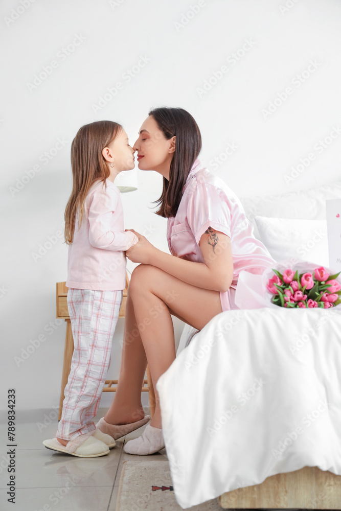 Canvas Prints happy mother with her cute little daughter touching noses in bedroom on holiday