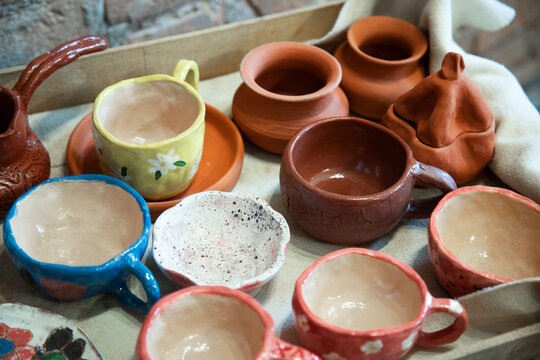  Pottery workshop with crockery .  Clay products collection at workshop .