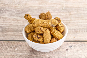 Raw ripe unpeeled peanut heap