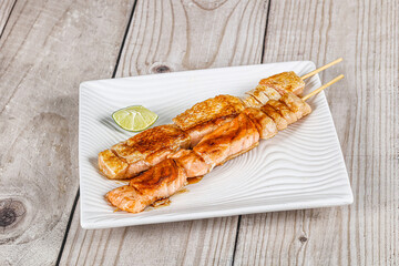 Grilled salmon skewer with sauce