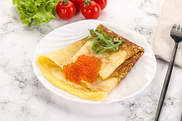 Russian pancake with red caviar