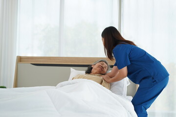 Healthcare Support: Nurse Assistant Help Senior Woman Rest Comfortably at Home