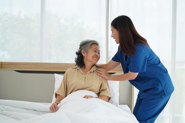 Healthcare Support: Nurse Assistant Help Senior Woman Rest Comfortably at Home