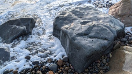 The Melted Rocks of Swamis Beach. Erosion control boulders put down along the shore 50 years ago...