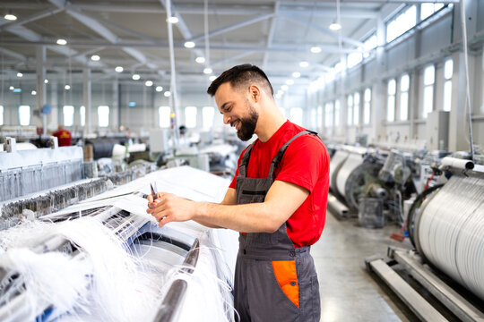 Production line worker making polyester carpets.