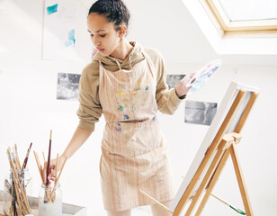 Art, inspiration and palette with painter woman in studio for creative, expression or leisure...