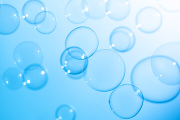 Beautiful Transparent Blue Soap Bubbles Background. Celebration Festive Backdrop. Freshness Soap Suds Bubbles Water. Blue Textured Abstract Background.