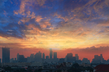 sunset background on cityscape of building silhouette,At twilight in Bangkok ,Thailand