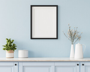square black wooden poster frame. Soft pastel blue wall with a satin finish. Distressed white cabinets