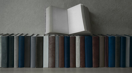 mockup blank template. Stack of opened old books lien on wooden shelf. 1 one empty Open book. front...