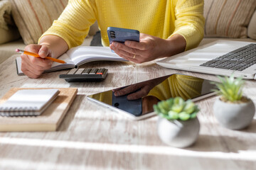 Woman Setting Financial Goals at Home, Organizing Her Finances and Controlling Daily Expenses.