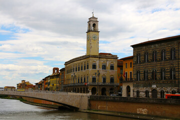 View of the ancient building Palazzo Pretorio on the banks of the Arno river in the municipality of...