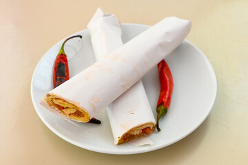 Lavash doner kebab ( zurna et tavuk doner durum )  or shawarma sliced in plate isolated. 