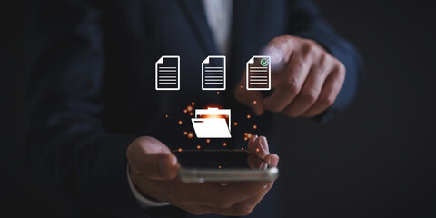 Businessman with Document Management System (DMS), Online Document Database and automated processes in file management, Business Technology management files concept.