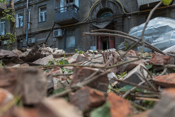 A Russian missile hit a residential building in the city of Dnipro, Ukraine. Damaged apartment building after a massive missile attack on 04.19.24. Scars of war. Consequences of the attack - obrazy, fototapety, plakaty