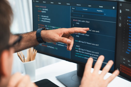 IT developers creating online software development information on screen laptop with coding program in data of application and website. Technical engineer coder on safety program concept. Sellable.