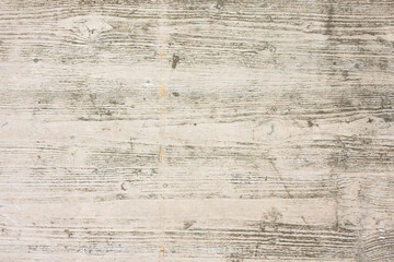 The surface of a concrete slab with the imprint of a wooden texture from a formwork board....