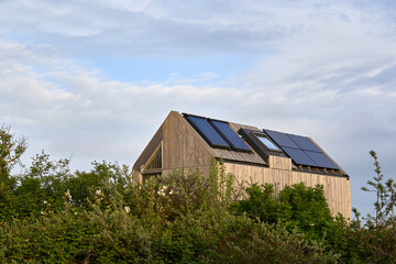 Environmentally friendly eco house with solar cells and photovoltaic. Sustainable vacation home in nature. Holland, Zeeland.