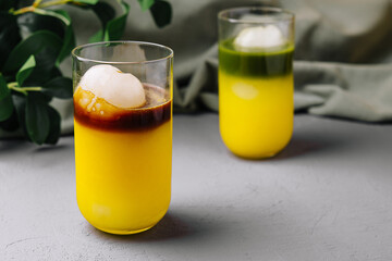 Tropical ice ball cocktail on modern countertop