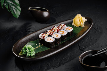 Gourmet sushi platter on elegant dark background