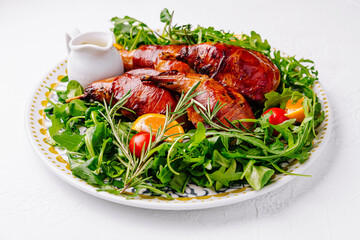 Gourmet roast quail on arugula salad