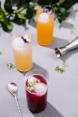 Refreshing summer cocktails on modern table