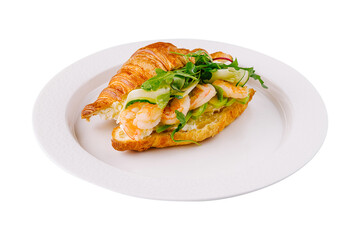 Gourmet shrimp and avocado croissant sandwich