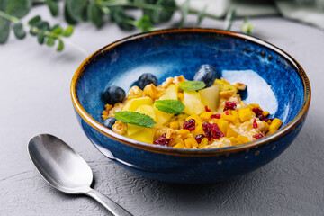 Fresh fruit salad in blue bowl