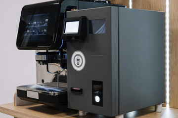 Modern espresso machine on wooden counter