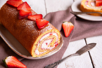 Swiss roll with strawberries and cream, homemde dessert - 789940437