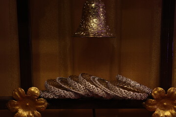 stone studded bangles spread on lot lit area