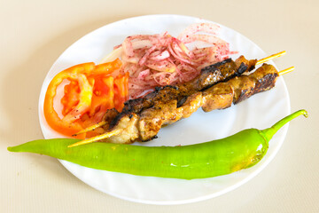 Beef steak grill with rice pilaf, fried potatoes, grilled pepper and tomatoes.Mix Platter with Beef rips, Cutlets, Potatoes and Sauces.